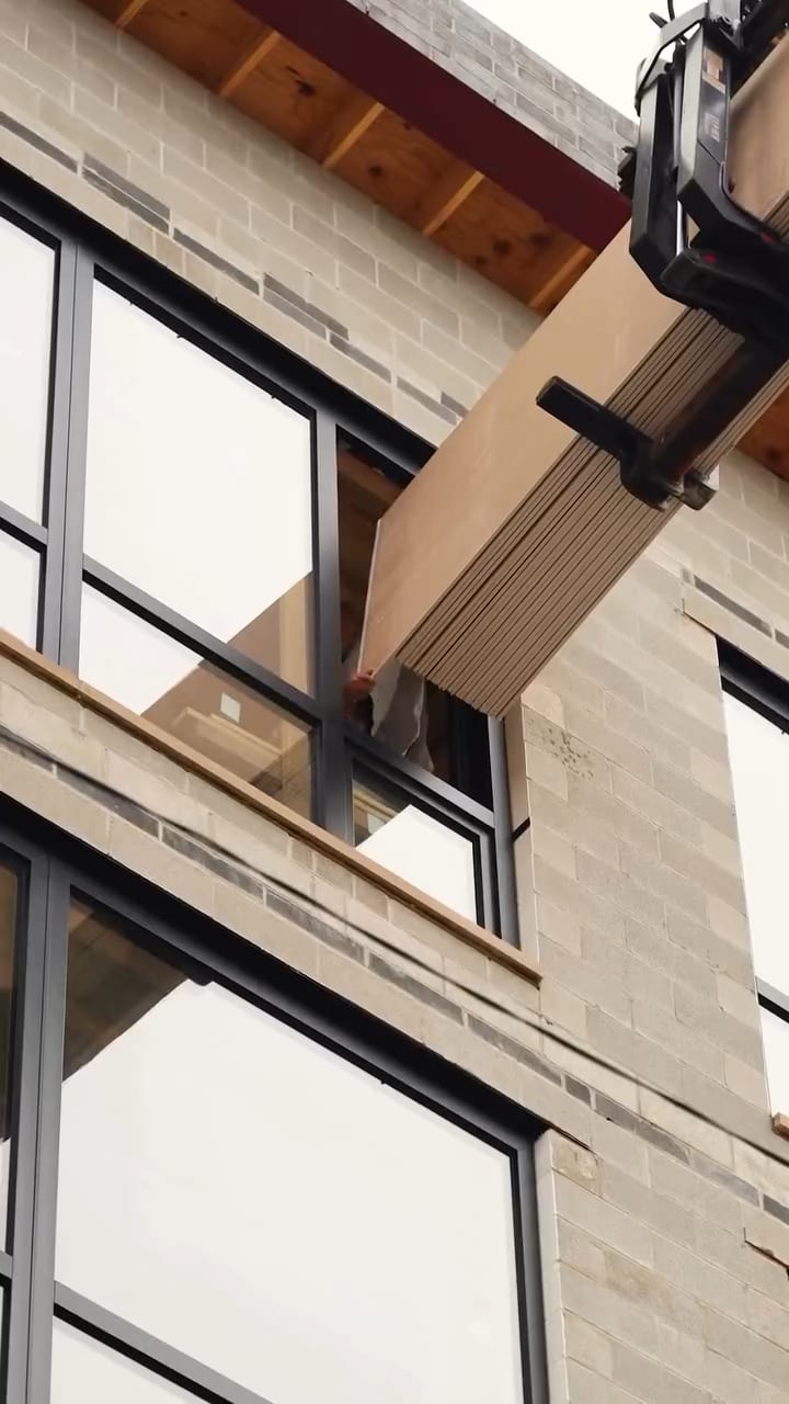Drywall sheets being delivered into a new build