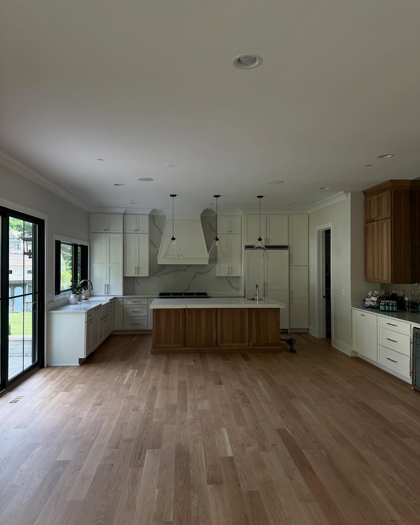 Freshly painted modern kitchen with oak island