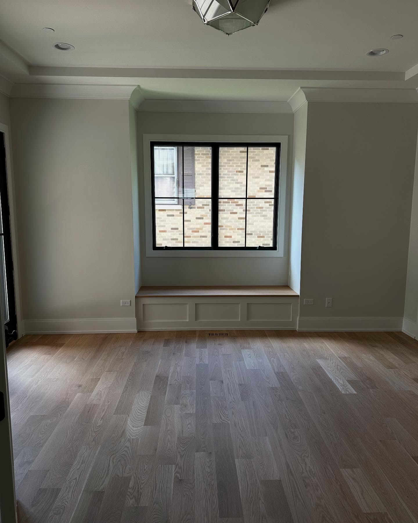 Finished room with crown molding and window seat in Clarendon Hills