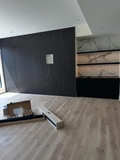 Large new construction home with JVP Drywall Solutions signage